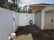 Small backyard with shed and white vinyl fence at 3100 Sheboygan Ave, North Port, FL 34286