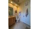 Clean bathroom with wooden vanity and tiled floor at 3100 Sheboygan Ave, North Port, FL 34286