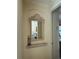 Elegant entryway with decorative mirror and shelf at 3100 Sheboygan Ave, North Port, FL 34286