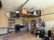 Garage with overhead storage and ample shelving for tools and equipment at 3100 Sheboygan Ave, North Port, FL 34286