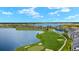 Community overview featuring a lake, golf course, and condos at 43981 Boardwalk Loop # 2218, Punta Gorda, FL 33982