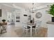 Bright dining room with table, chairs, and chandelier at 43981 Boardwalk Loop # 2218, Punta Gorda, FL 33982