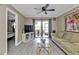 Spacious living room with access to a patio and lake view at 25225 Rampart Blvd # 1901, Punta Gorda, FL 33983