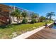 Landscaped yard leading to private dock on canal at 4431 Gardner Dr, Port Charlotte, FL 33952