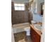 Clean bathroom with tub, shower, and vanity at 161 Coblentz St, Port Charlotte, FL 33954