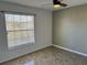 Bright bedroom with tiled floors and window coverings at 161 Coblentz St, Port Charlotte, FL 33954