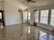 Large living room with tile floors and lots of natural light at 161 Coblentz St, Port Charlotte, FL 33954