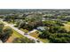 Single-story home situated on a large lot near the coast, with lush landscaping at 18565 Edgewater Dr, Port Charlotte, FL 33948