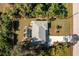 Aerial view of single-story house, pool, and driveway at 18565 Edgewater Dr, Port Charlotte, FL 33948