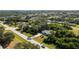 Single-story home located on a large lot near the coast with mature trees and lush landscaping at 18565 Edgewater Dr, Port Charlotte, FL 33948