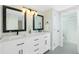 Modern bathroom with double vanity, quartz countertop, and large mirrors at 18565 Edgewater Dr, Port Charlotte, FL 33948