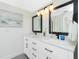 Modern bathroom with double vanity, quartz countertop, and large mirrors at 18565 Edgewater Dr, Port Charlotte, FL 33948