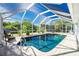 Enclosed, refreshing pool with plenty of space for relaxation at 18565 Edgewater Dr, Port Charlotte, FL 33948