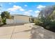 White single-story home with white garage doors and landscaped front yard at 210 Divinci Dr, Punta Gorda, FL 33950