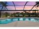 Relaxing, rectangular pool with a covered lanai overlooking the canal at 210 Divinci Dr, Punta Gorda, FL 33950