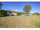 Large backyard with grassy area and canal view at 221 Sportsman Rd, Rotonda West, FL 33947