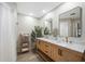 Elegant bathroom with double vanity, marble countertop, and modern fixtures at 221 Sportsman Rd, Rotonda West, FL 33947