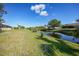 Peaceful canal view from the backyard at 221 Sportsman Rd, Rotonda West, FL 33947