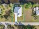 Bird's-eye view of a single-story house with a metal roof and driveway at 28492 Royal Palm Dr, Punta Gorda, FL 33982