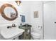 Charming bathroom with shiplap walls, white subway tile shower, and vintage sink at 28492 Royal Palm Dr, Punta Gorda, FL 33982