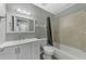 Clean bathroom with white vanity and tub at 3324 Avanti Cir, North Port, FL 34287