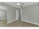 Bedroom with mirrored closet and ceiling fan at 3324 Avanti Cir, North Port, FL 34287