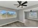 Bright bedroom with ceiling fan and wood-look flooring at 3324 Avanti Cir, North Port, FL 34287