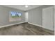 Bright bedroom with wood-look floors and ceiling fan at 3324 Avanti Cir, North Port, FL 34287