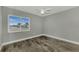 Well-lit bedroom with wood-look floors and window at 3324 Avanti Cir, North Port, FL 34287