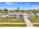 Single-story home with a white garage door and well-maintained lawn at 3324 Avanti Cir, North Port, FL 34287