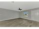 Living room with gray walls and wood-look tile floors at 3324 Avanti Cir, North Port, FL 34287