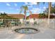 Community hot tub surrounded by green chairs at 3820 Tripoli Blvd # 42, Punta Gorda, FL 33950