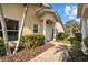 Front entrance with columns, walkway, and landscaping at 3820 Tripoli Blvd # 42, Punta Gorda, FL 33950