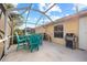 Screened patio with table, chairs, and grill at 3820 Tripoli Blvd # 42, Punta Gorda, FL 33950