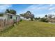 Large backyard with grassy area and wooden fence at 3999 Conway Blvd, Port Charlotte, FL 33952