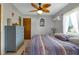 Bright bedroom with a king-size bed and built-in dresser at 3999 Conway Blvd, Port Charlotte, FL 33952