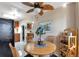 Bright dining area with wood table and view into kitchen at 3999 Conway Blvd, Port Charlotte, FL 33952