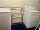 Laundry room with washer, dryer, and additional storage at 3999 Conway Blvd, Port Charlotte, FL 33952