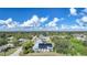 Aerial view of house with solar panels and lush surroundings at 4132 Michel Tree St, Port Charlotte, FL 33948