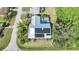 House with solar panels and pool, viewed from above at 4132 Michel Tree St, Port Charlotte, FL 33948