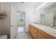 Clean bathroom with double vanity and access to bedroom at 4132 Michel Tree St, Port Charlotte, FL 33948