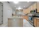 Bright kitchen with an island and stainless steel appliances at 4132 Michel Tree St, Port Charlotte, FL 33948