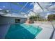 Inviting screened pool area with a hot tub and ample deck space at 4132 Michel Tree St, Port Charlotte, FL 33948