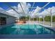 Refreshing pool with screened enclosure and spa at 4132 Michel Tree St, Port Charlotte, FL 33948