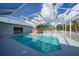 Relaxing pool and spa with screened enclosure at 4132 Michel Tree St, Port Charlotte, FL 33948