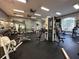 Fully-equipped gym with modern exercise machines, free weights, and mirrored walls at 4178 Central Sarasota Pkwy # 326, Sarasota, FL 34238