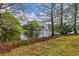 Serene pond surrounded by lush greenery, offering a tranquil environment at 4178 Central Sarasota Pkwy # 326, Sarasota, FL 34238