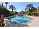 Inviting outdoor pool surrounded by palm trees and lounge chairs for relaxation at 4178 Central Sarasota Pkwy # 326, Sarasota, FL 34238