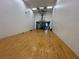 Well-lit racquetball court with hardwood floors for recreational enjoyment at 4178 Central Sarasota Pkwy # 326, Sarasota, FL 34238