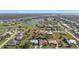 Aerial view of a luxury home community with golf course and water views at 4315 Cape Haze Dr, Placida, FL 33946